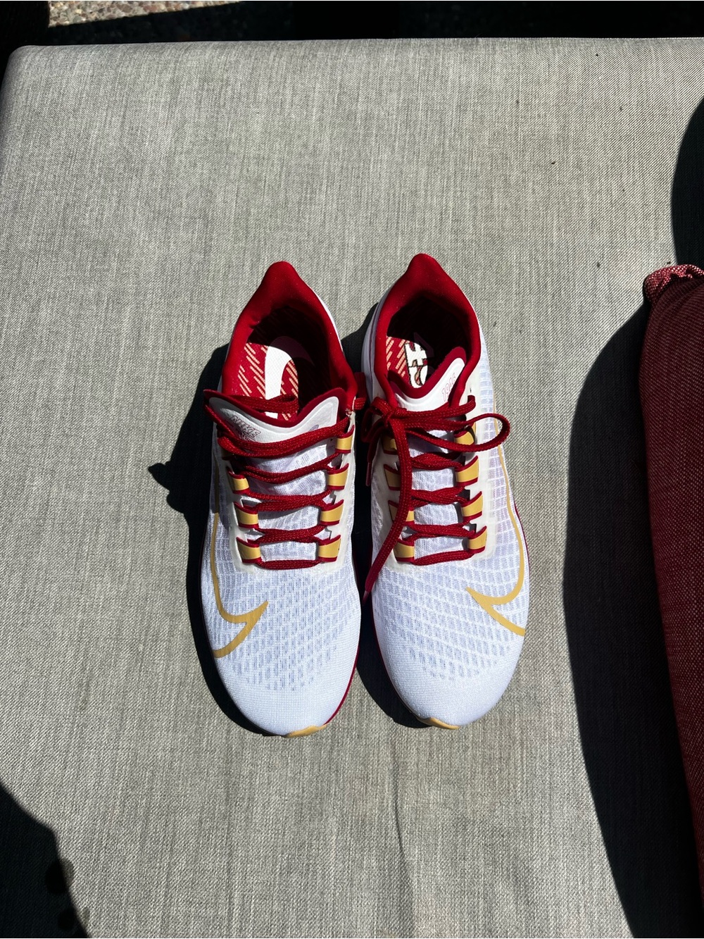 Nike White Sneakers with Red Lining and Gold Swoosh